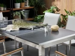 Beliani 6-istuttava Ulkoruokailuryhmä Poltettu Graniittitaso Tekstiilituolit Musta/valkoinen GROSSETO -Beliani-myymälä undef src sa picid 764218 type whitesh image